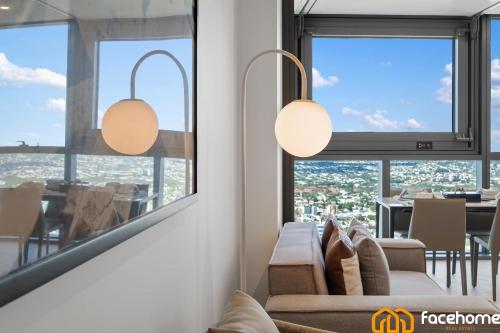 a living room with a view of a dining room at City Luxury Stay River & City Access in Brisbane