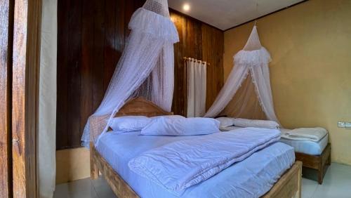 Katil atau katil-katil dalam bilik di Calma Surf House
