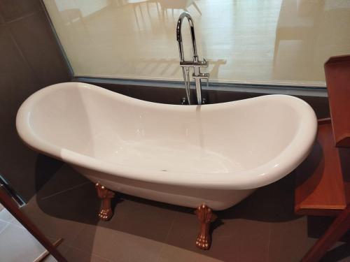 a white sink with a faucet in a bathroom at Oak Ray Tea Bush in Ramboda