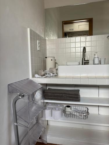 a kitchen with a sink and a counter top at Kimnung House Anmok in Jeju