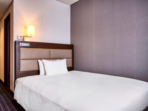 Katil atau katil-katil dalam bilik di Royal Pines Hotel Yonezawa - Opening in Mar 2025