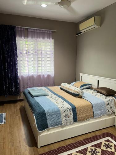 Ένα ή περισσότερα κρεβάτια σε δωμάτιο στο K2 Villas Homestay