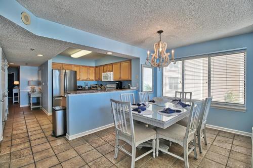 a kitchen and dining room with a table and chairs at Oceanfront Crescent Shores Unit 106-Sleep12-4 bedrooms-6 beds-3 bathrooms in North Myrtle Beach