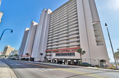 a large white building with a street in front of it at Oceanfront Crescent Shores Unit 106-Sleep12-4 bedrooms-6 beds-3 bathrooms in North Myrtle Beach