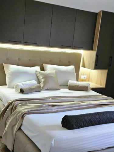 Postel nebo postele na pokoji v ubytování V&L Apartman