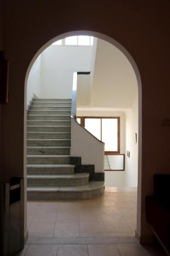 an archway leading to a staircase in a house at Hotel Saint Georges Tunis in Tunis
