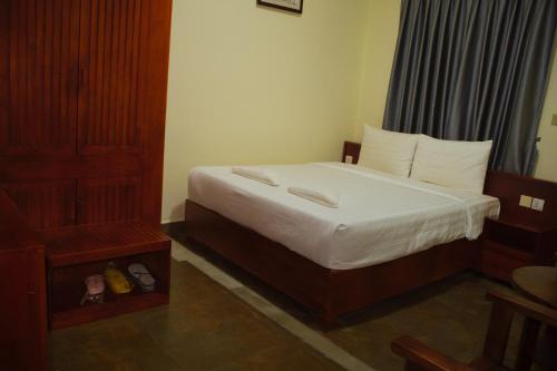 Una cama o camas en una habitación de LISEKA Hotel