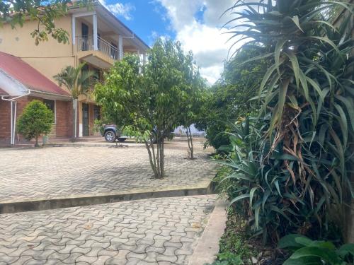 a cobblestone street in front of a building at Kabale 2 bedroom flat in Katale