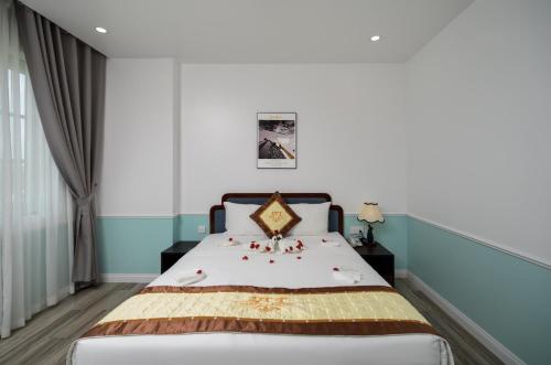 Postel nebo postele na pokoji v ubytování Harry Phu Quoc Hotel 3