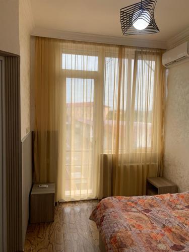 Postel nebo postele na pokoji v ubytování Guest House Kakha