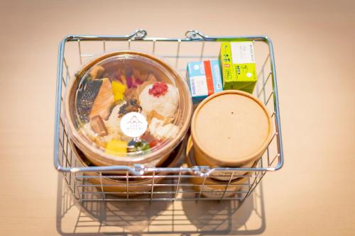 a wire basket filled with different types of food at Tabi and Nagasaki Grand Open!! 2025 in May in Nagasaki
