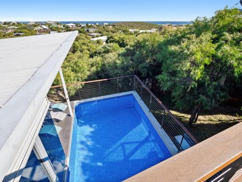 a swimming pool on the roof of a house at A La Plage - Ocean View Luxury - Family Friendly in Gnarabup