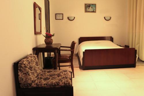 Un ou plusieurs lits dans un hébergement de l'établissement Hotel Saint Georges Tunis