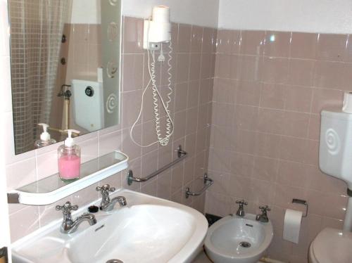 a bathroom with a sink and a toilet at Sao Roque in Portimão