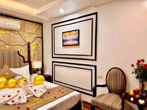 a hotel room with a bed and a chair at Bảo Anh Hotel in Hanoi