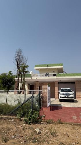 a car parked in front of a house at Sheopur Shikaar Oudi in Sheodāspura