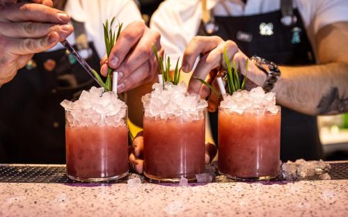 a group of three cocktails sitting on a counter at Kimpton De Witt Amsterdam by IHG in Amsterdam