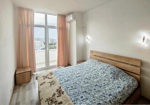 Llit o llits en una habitació de Panoramic apartment