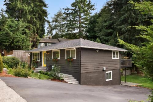 a small house with a garage at Spacious Main Street Retreat for families and large groups in Edmonds