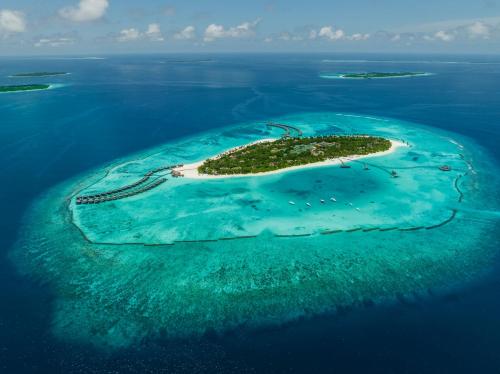 an island in the middle of the ocean at Sun Siyam Iru Fushi with Free Transfer in Manadhoo