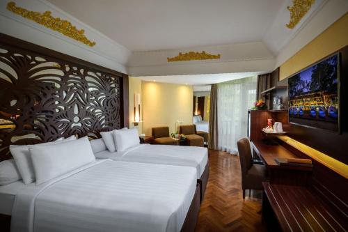 Un ou plusieurs lits dans un hébergement de l'établissement Prama Sanur Beach Bali