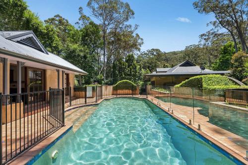 a swimming pool in the backyard of a house at The Manor by Coast Hosting in Holgate