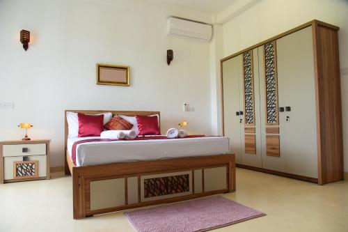 Ένα ή περισσότερα κρεβάτια σε δωμάτιο στο Ayurishi Villa