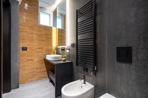 a bathroom with a sink and a toilet in it at 4 Season Cognetti in Bari