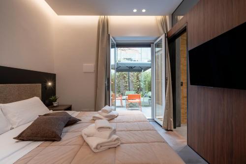 a bedroom with two beds with towels on them at 4 Season Cognetti in Bari