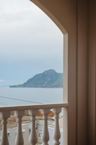 a view of the ocean from a balcony at Finikas Apartments in Plakias