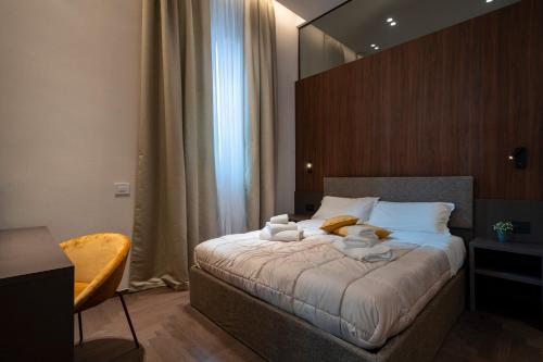 a bedroom with a bed with two stuffed animals on it at 4 Season Cognetti in Bari