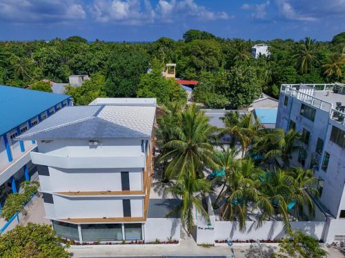 an aerial view of the resort with palm trees and buildings at The Palms Thoddoo in Thoddoo