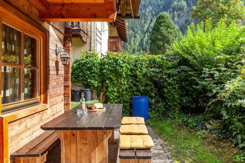a wooden table sitting on the side of a house at Trucks Hütte in Mayrhofen
