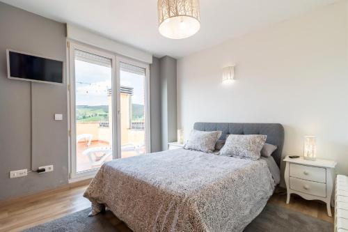 Ένα ή περισσότερα κρεβάτια σε δωμάτιο στο Luminoso apartamento con terraza
