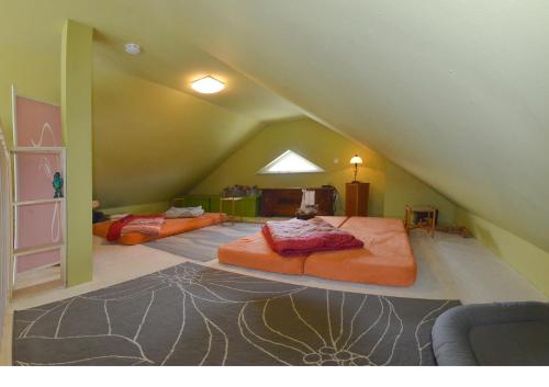 a room with two beds in a attic at Ferienwohnung Vilzsee in Mirow