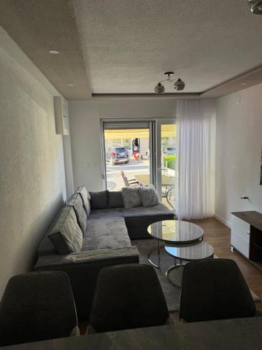 a living room with a couch and a table at Apartment Agape in Posušje