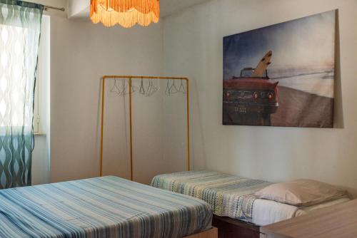 Postel nebo postele na pokoji v ubytování Casa Melograno