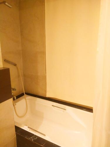 Un baño de Hotel Delight Landmark