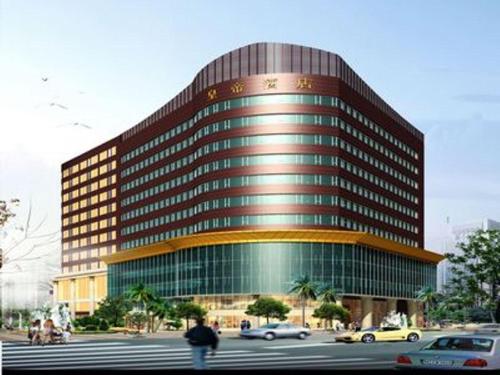 a large building with cars parked in front of it at Shunde Emperor Hotel in Shunde