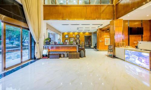 a large room with a kitchen and a lobby at James Joyce Coffetel·Lijiang Old Town Centeral in Lijiang
