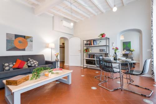 a living room with a couch and a table at Rome as you feel - Grotta Pinta apartments in Rome
