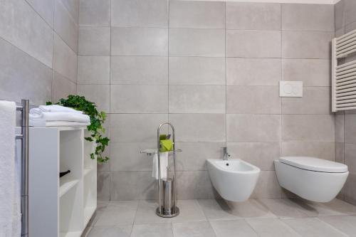 a bathroom with a toilet and a bidet at Rome as you feel - Grotta Pinta apartments in Rome