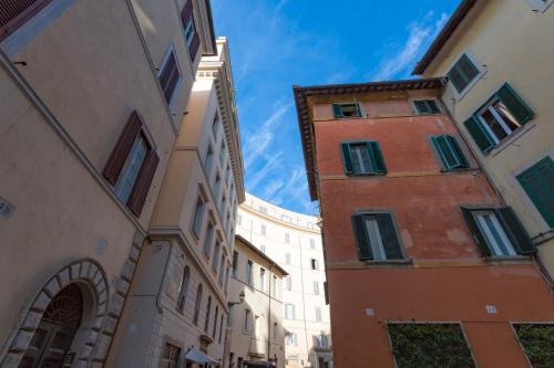 an alley between two buildings in a city at Rome as you feel - Grotta Pinta apartments in Rome