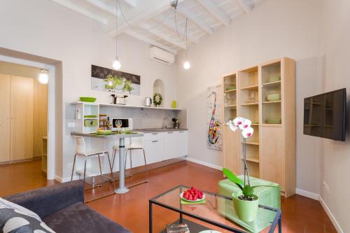 a living room with a couch and a table at Rome as you feel - Grotta Pinta apartments in Rome