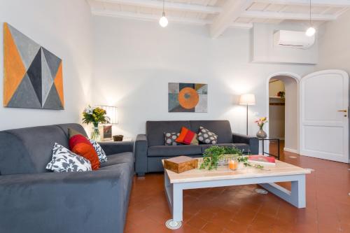 a living room with two couches and a coffee table at Rome as you feel - Grotta Pinta apartments in Rome
