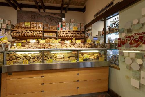 a bakery with a lot of different types of donuts at Rome as you feel - Grotta Pinta apartments in Rome