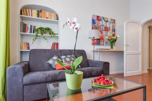 a living room with a couch and a table at Rome as you feel - Grotta Pinta apartments in Rome