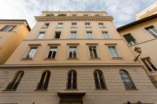 a tall building with many windows on top of it at Rome as you feel - Grotta Pinta apartments in Rome