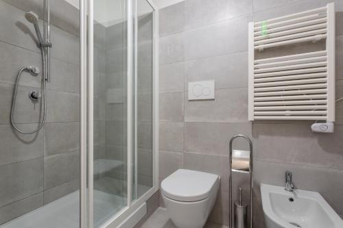 a bathroom with a shower and a toilet and a sink at Rome as you feel - Grotta Pinta apartments in Rome