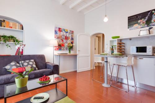 a living room with a couch and a table at Rome as you feel - Grotta Pinta apartments in Rome